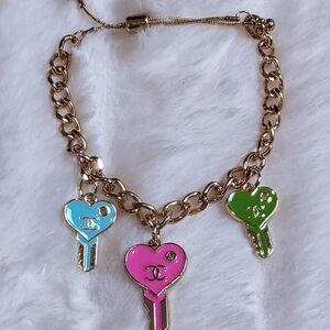 Gold Bracelet with Pink, Blue, and Green Heart Charms